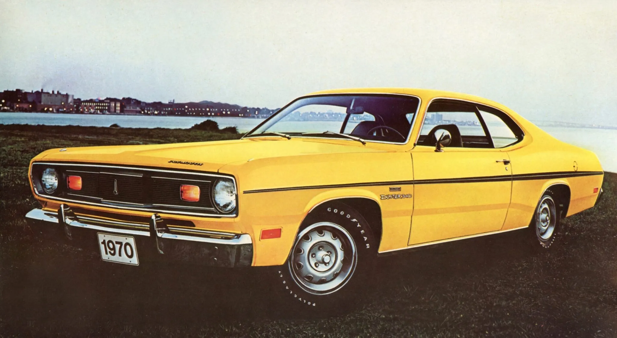 The engine bay of a 1970 Plymouth Duster 340, prominently featuring the HEMI Orange painted small-block engine