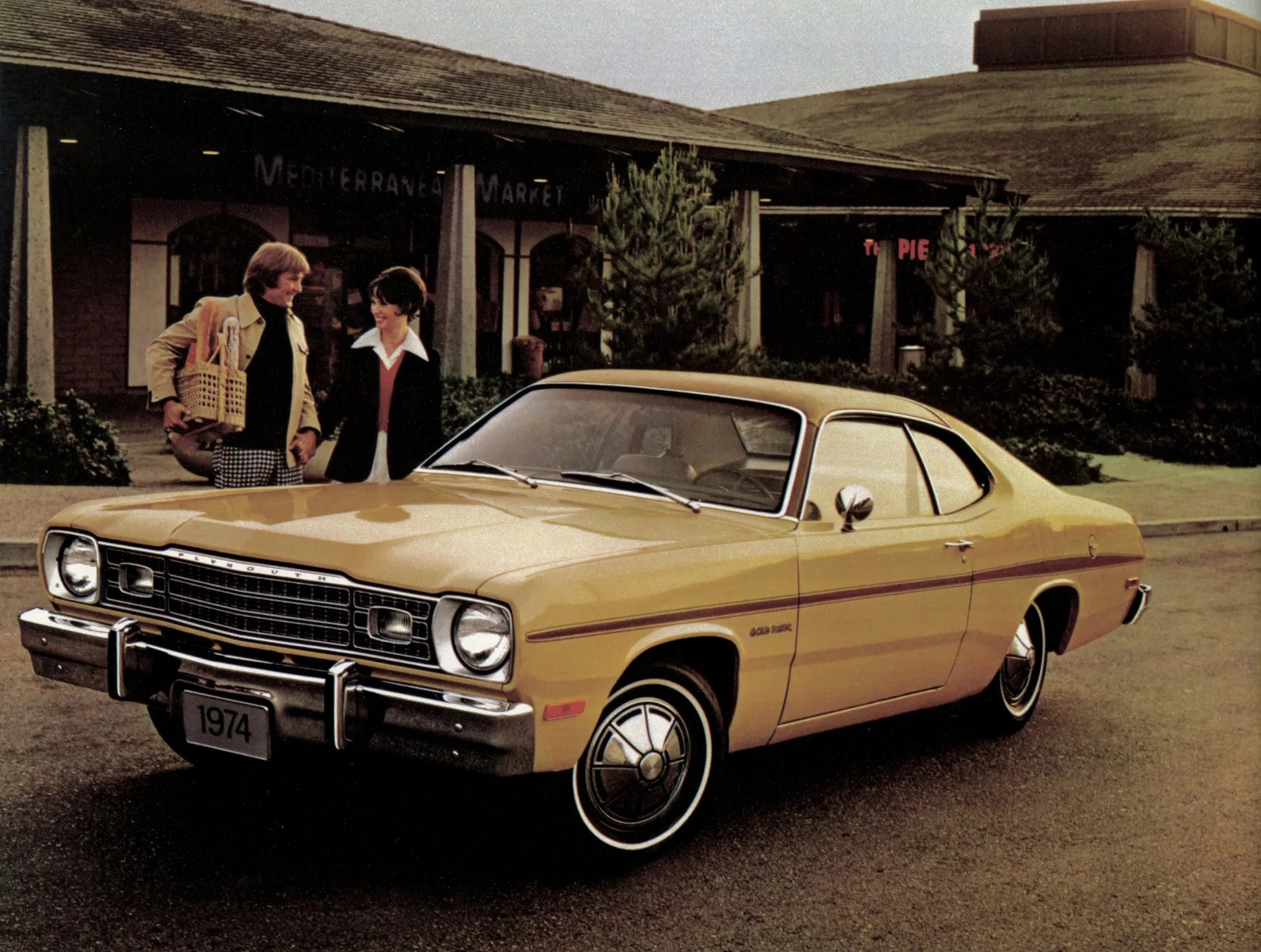 The front fascia of a 1974 Plymouth Duster, showcasing the updated grille, square headlight bezels, and larger bumper