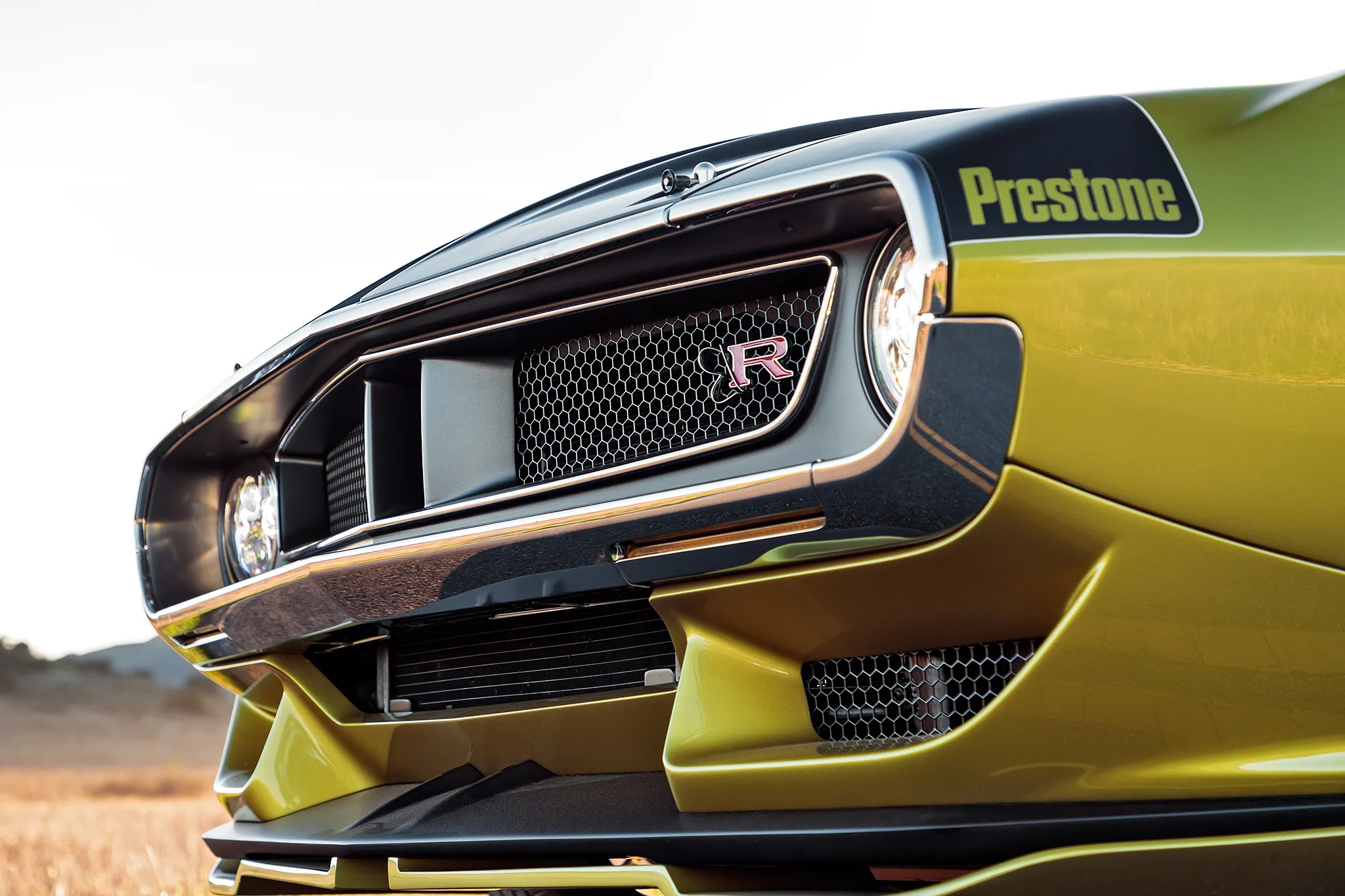 The Javelin Defiant in motion, highlighting its aggressive stance and wide rear tires