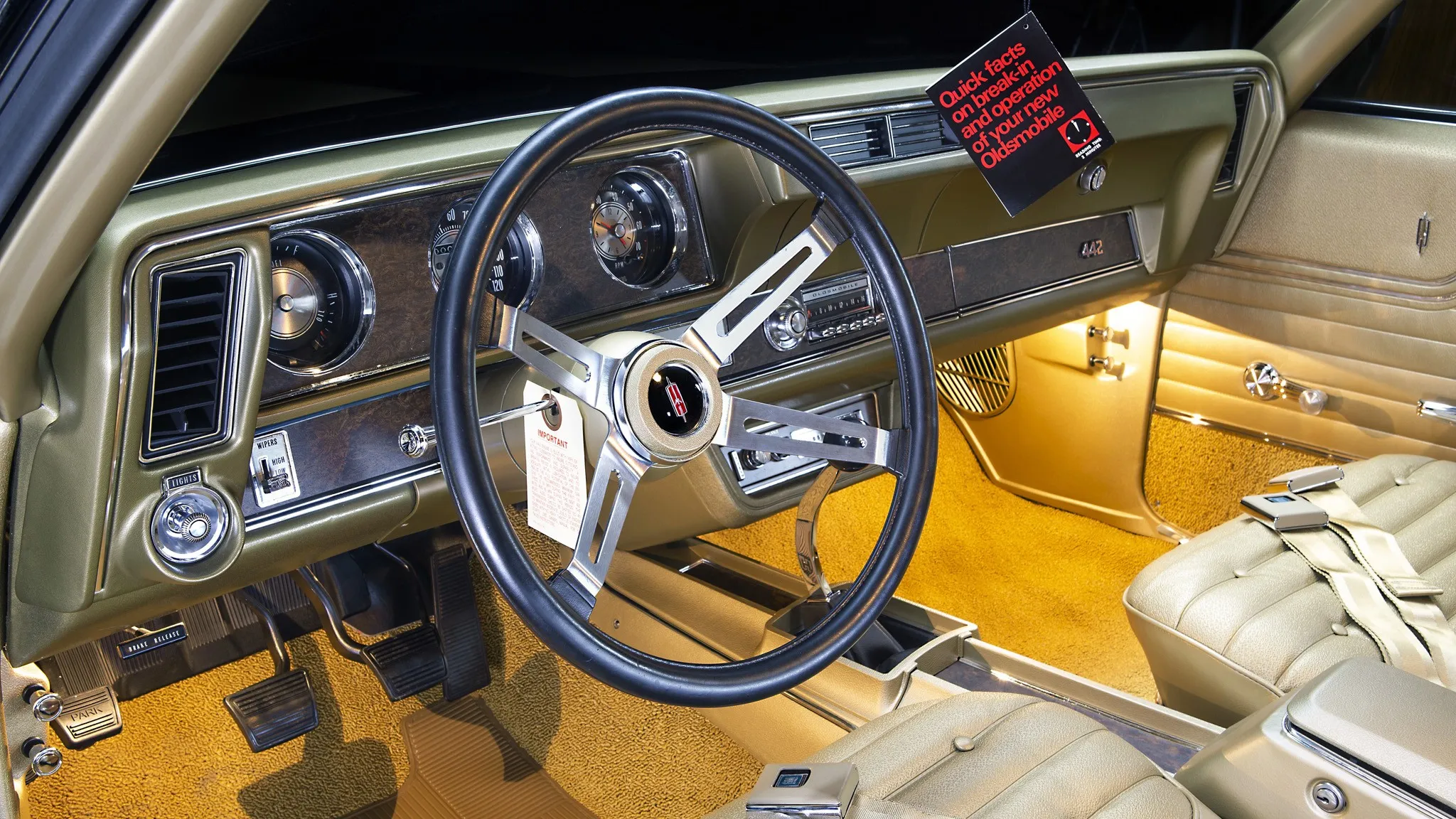 The meticulously crafted gold interior of the restored 1970 Oldsmobile 442 W30