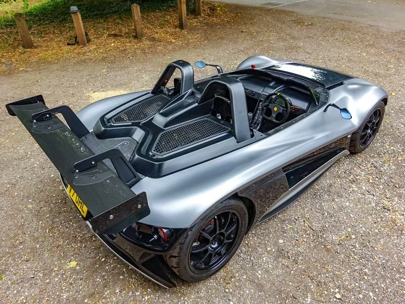 The side profile of the VUHL 05, showing its sleek lines, exposed chassis, and performance tires