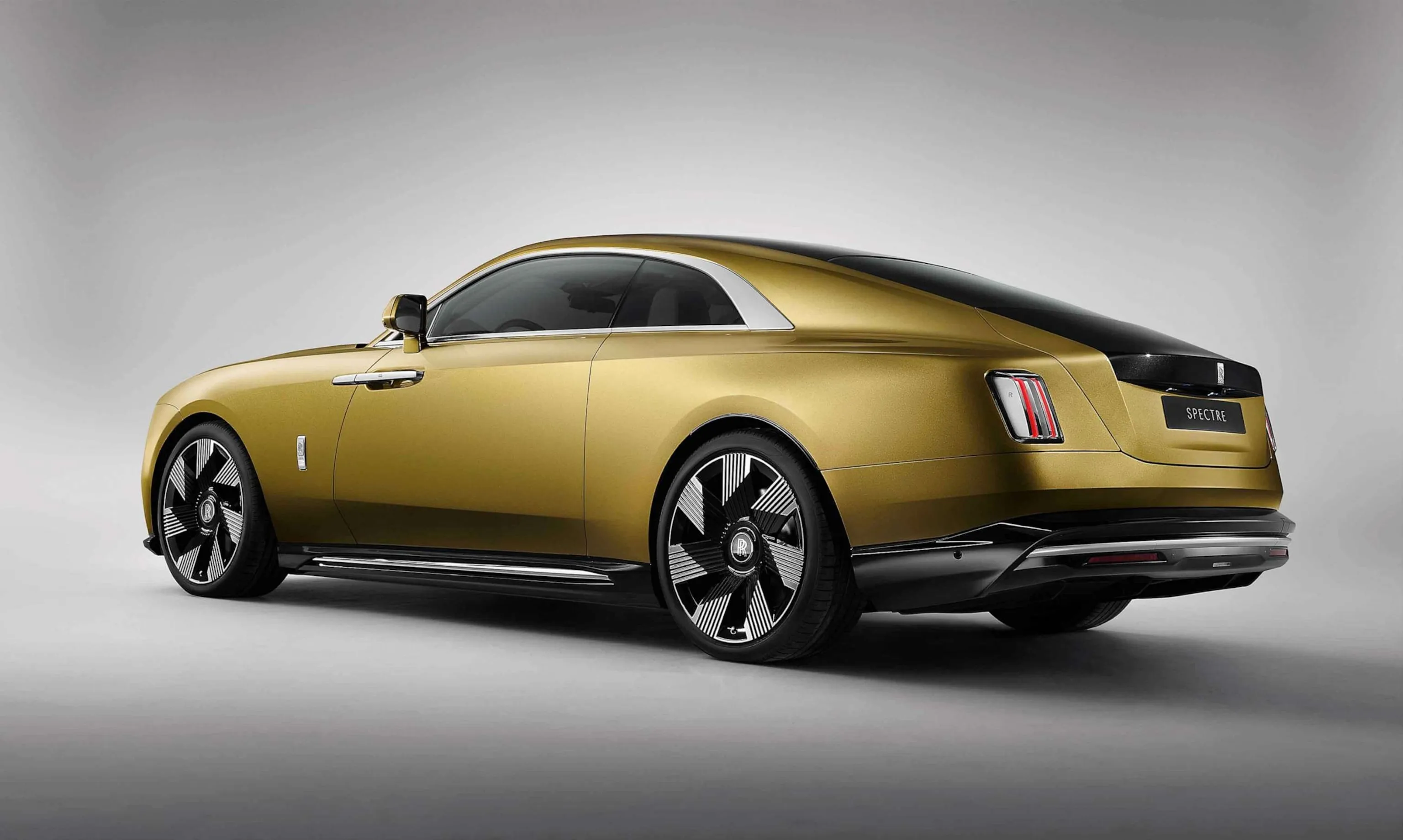 The sleek, aerodynamic profile of the all-electric Rolls-Royce Spectre coupe