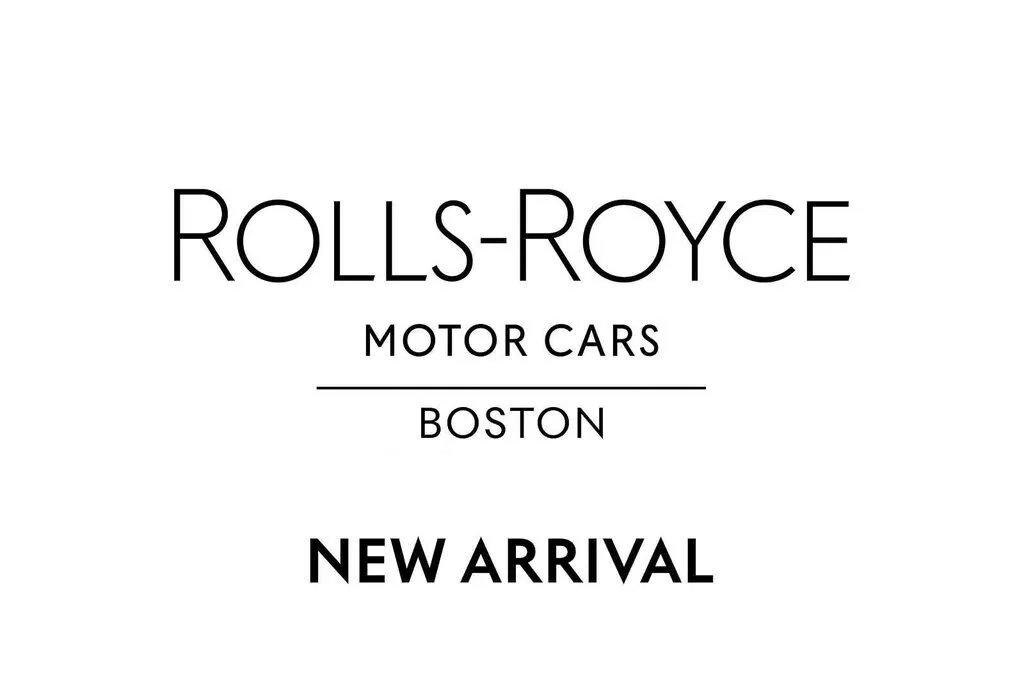 The sleek black exterior of a 2021 Rolls-Royce Ghost AWD, showcasing its elegant profile