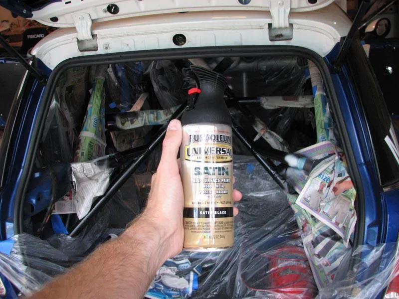 Top coat of satin black paint applied to the roll cage