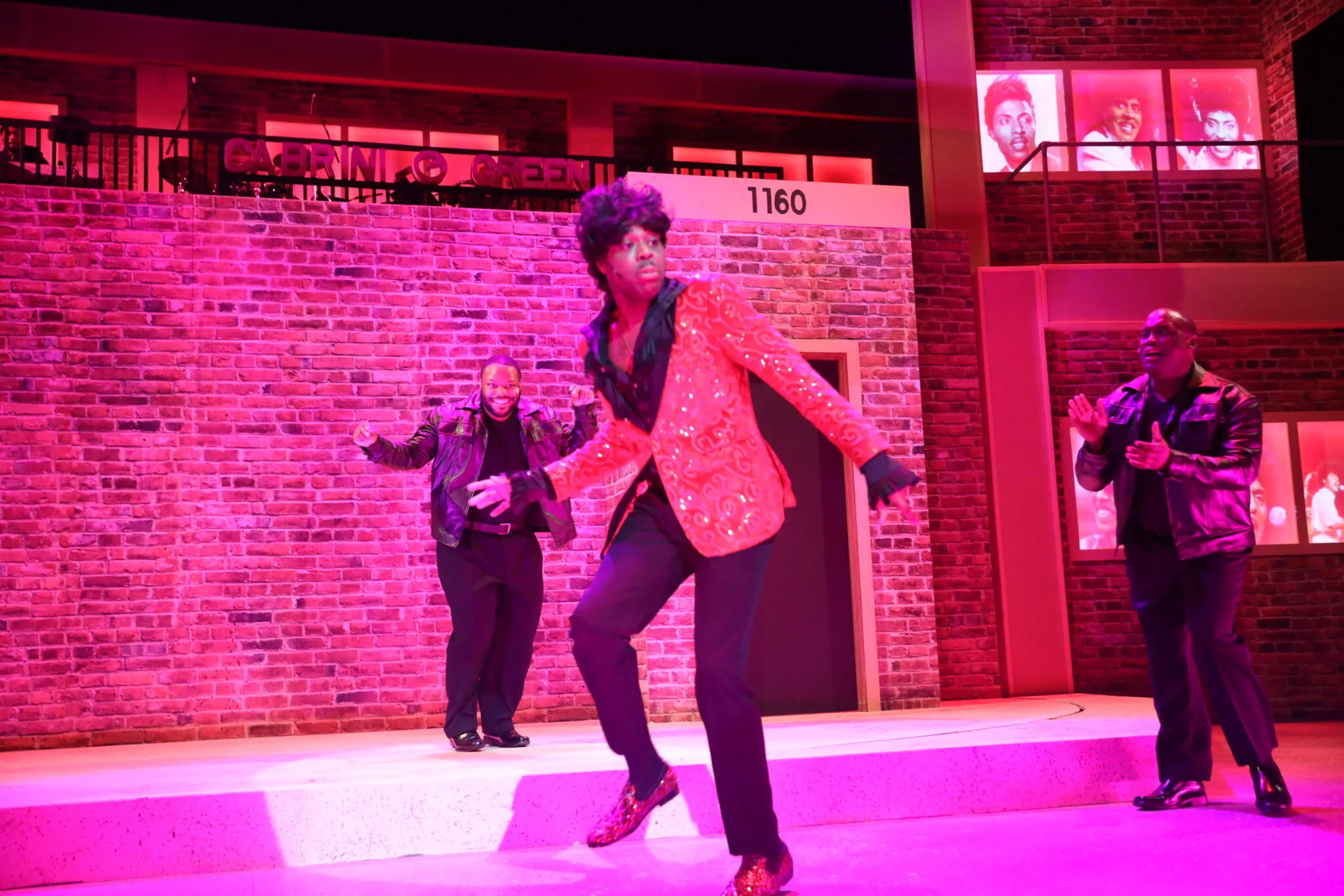 Trequon Tate leading the cast in an energetic musical number