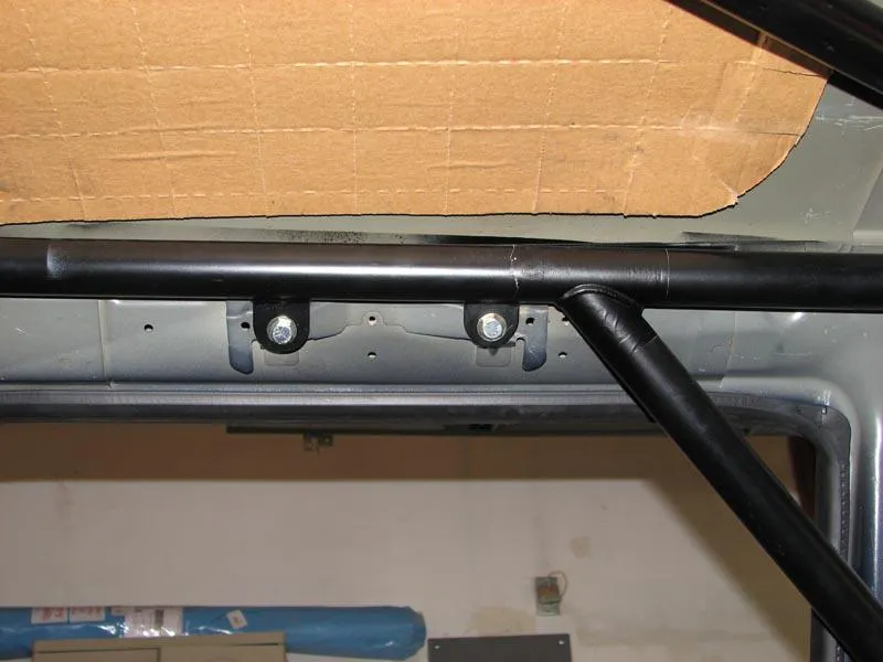 Upper tie-in points of the roll cage