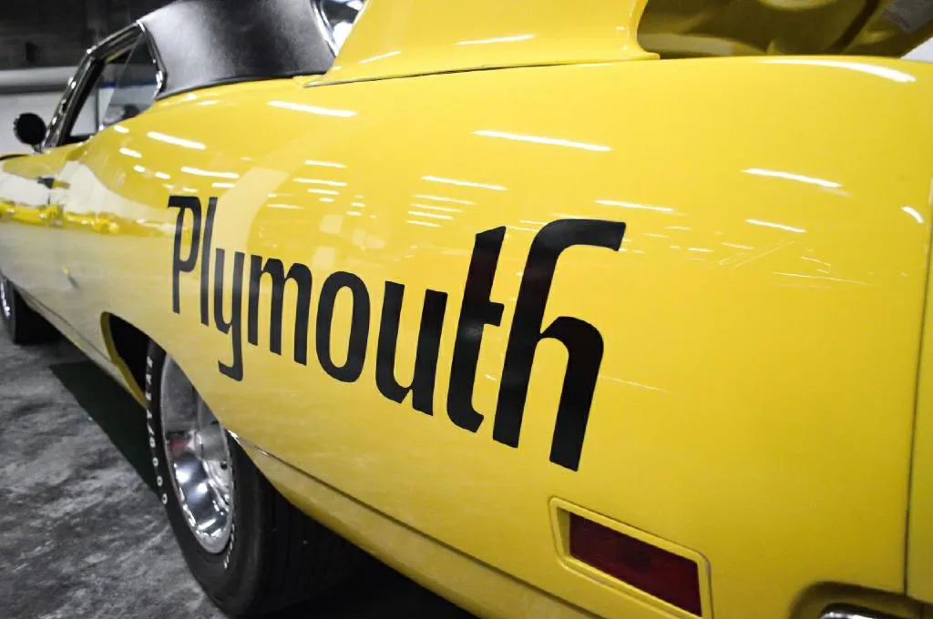 Various classic muscle cars displayed outdoors