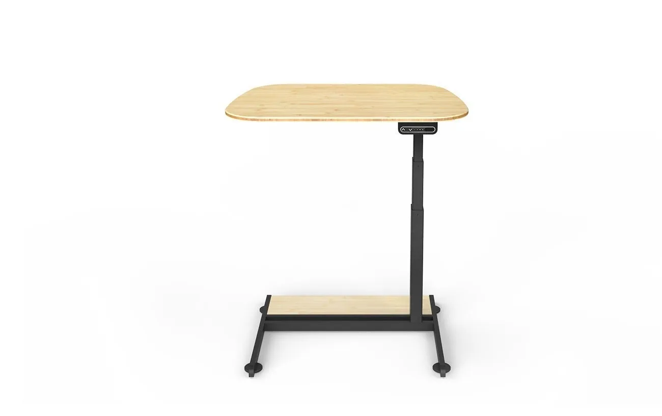 Xdesk Flex, a motorized standing desk, positioned beside a couch