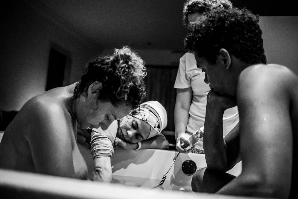 A heartwarming family moment with the new parents and their baby.