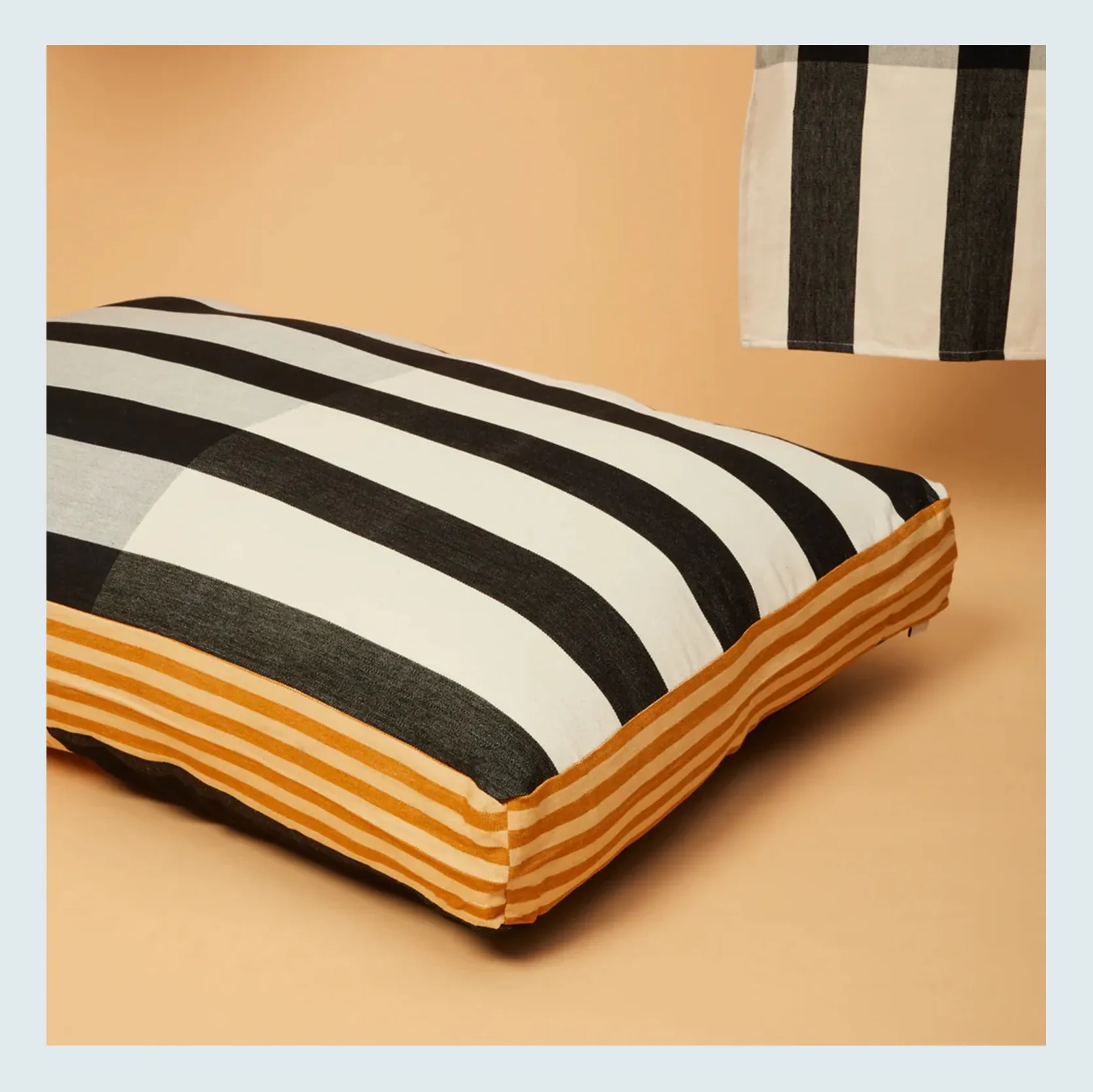 A luxurious, reversible dog bed with intricate patterns