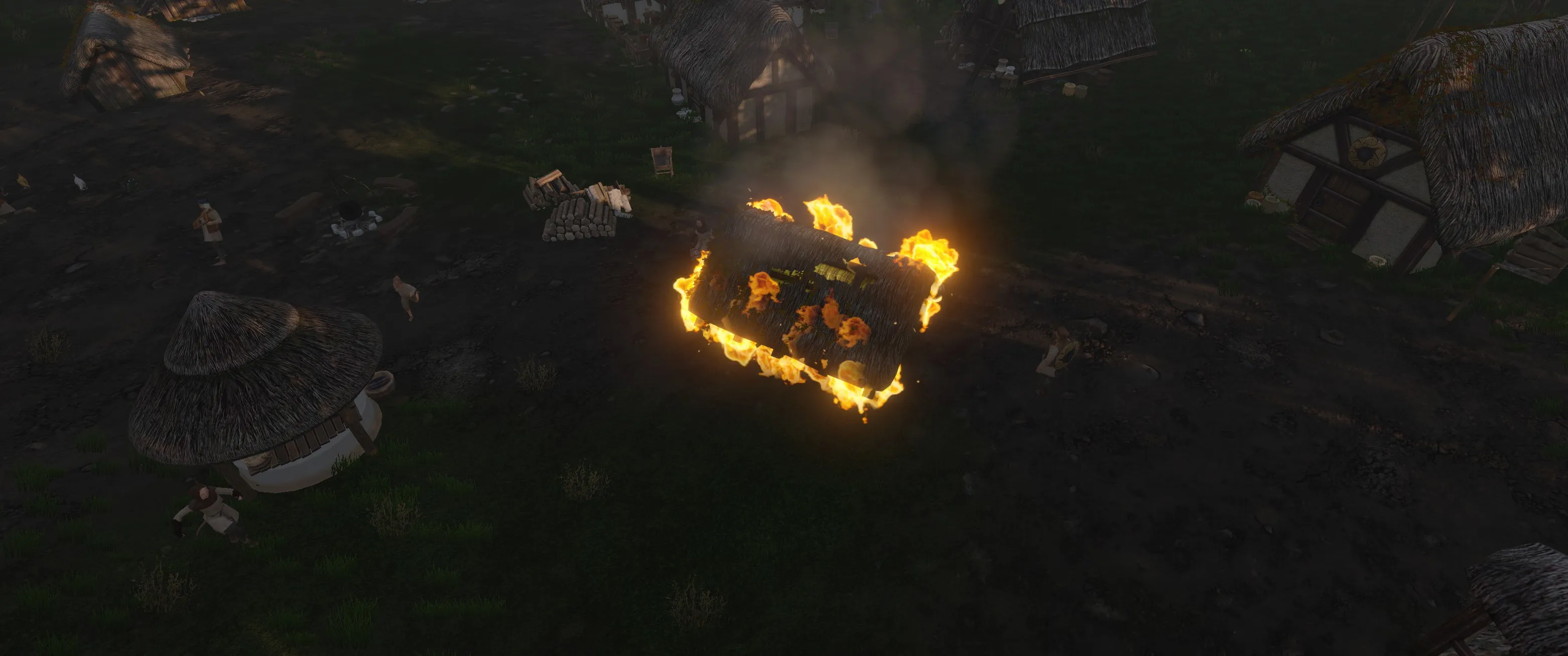 A shed fire at night, with a figure visible nearby, possibly the arsonist.
