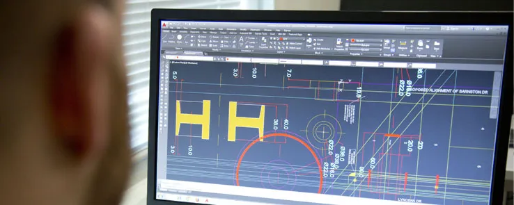 Computer Aided Design (CAD) Technician at a computer