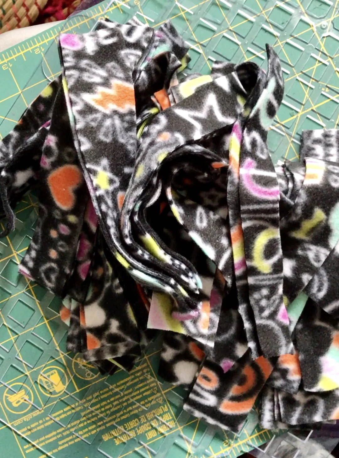 Fabric strips being cut for a canine enrichment toy