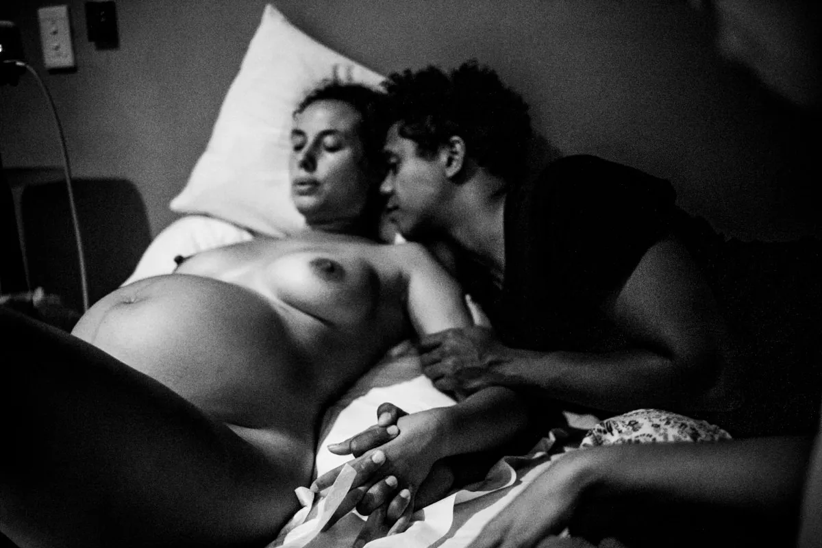 The photographer captures the intimate details of a newborn.