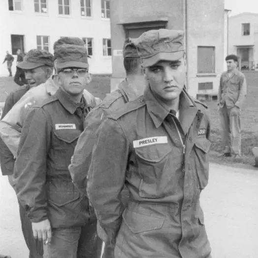 Elvis Presley in army uniform with other army recruits at a US base in Germany, 1958