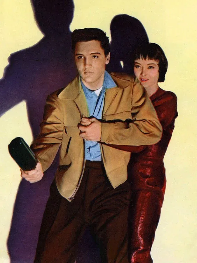 Elvis Presley wearing a chambray shirt and blouson