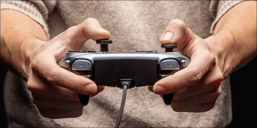 Gamer using controller thumb sticks