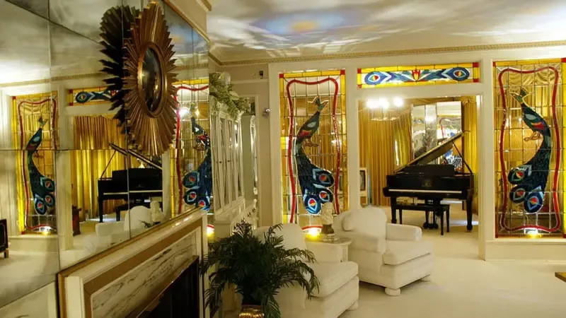 The living room of Graceland, decorated with gold curtains and peacock motifs, in the style that his girlfriend Lisa Thompson liked.