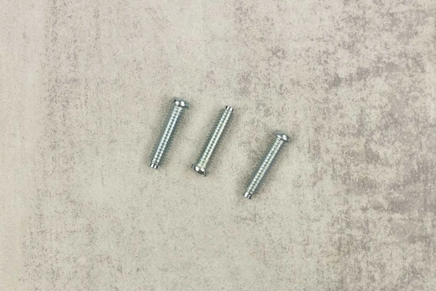 Three 1.1-inch bolts for 3-Bolt Mount assemblies displayed on granite-looking top.