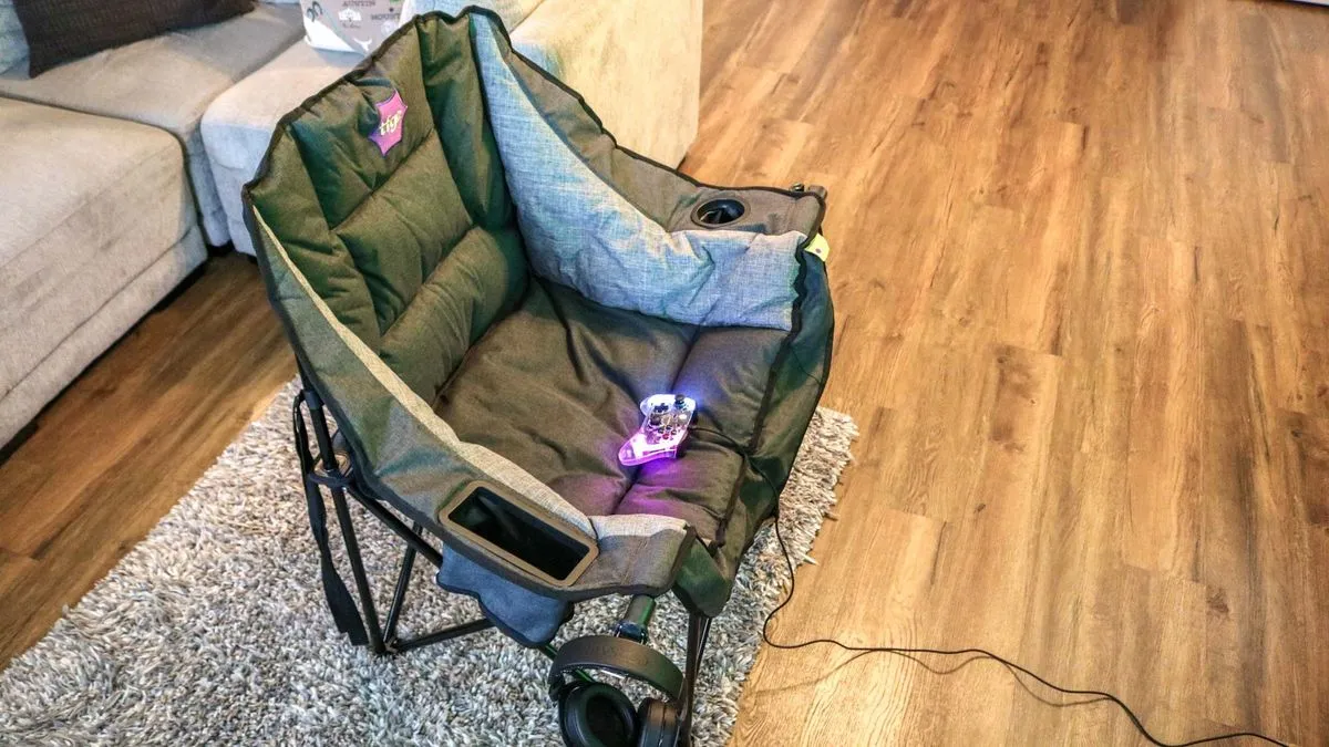 Using The Folding Gaming Chair in the living room in front of a couch