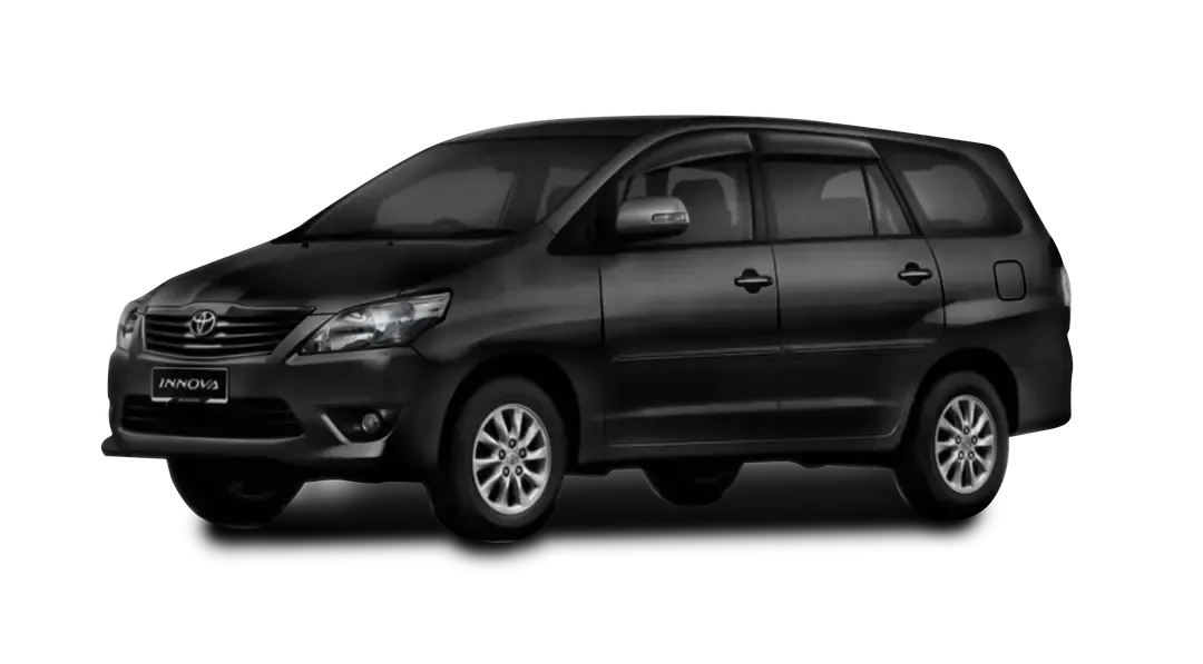 A silver Toyota Innova MPV, a spacious and reliable vehicle for group travel, shown in a professional fleet setting.