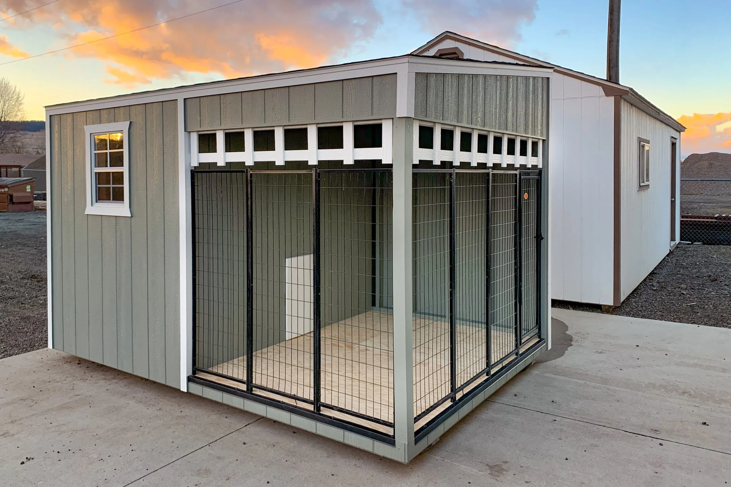 A well-designed 10x10 dog kennel featuring both indoor shelter and outdoor exercise run