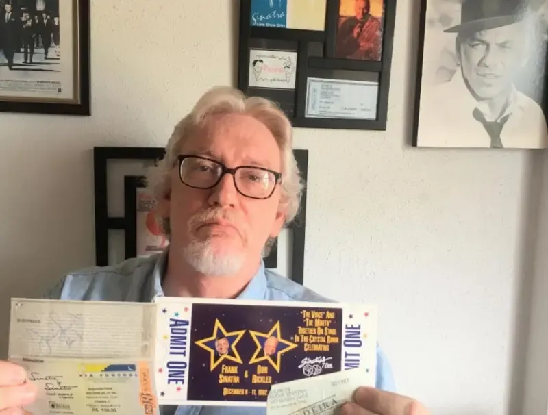Fan Renzo Mora proudly displaying his collection of tickets from Frank Sinatra’s concerts in Brazil
