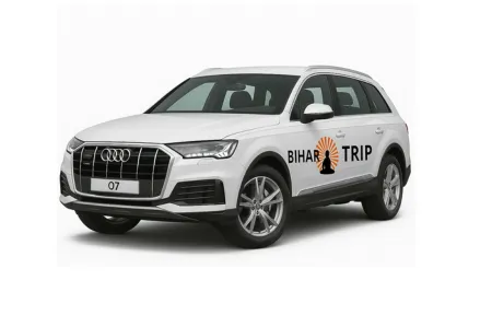 A front-angle shot of an Audi Q7 luxury SUV, emphasizing its large, imposing grille and executive presence