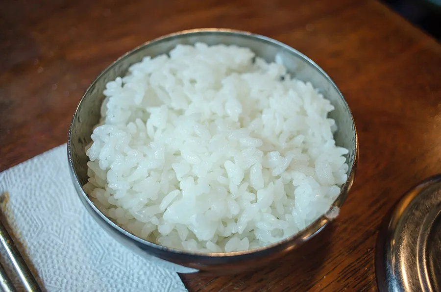 Boiled white rice and chicken prepared for a pet's bland diet