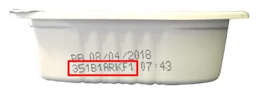 Close-up of lot code location on Cesar dog food tray for recall identification