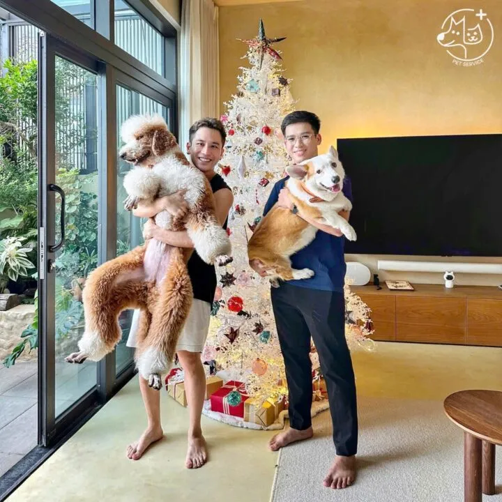 A satisfied pet owner and their dog, highlighting a trusting relationship with their grooming service