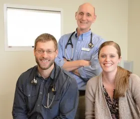Board-certified veterinary specialists and support staff at Upstate Veterinary Specialties posing together
