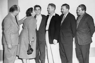 Elvis Presley signing his historic contract with RCA Records, a turning point in music history