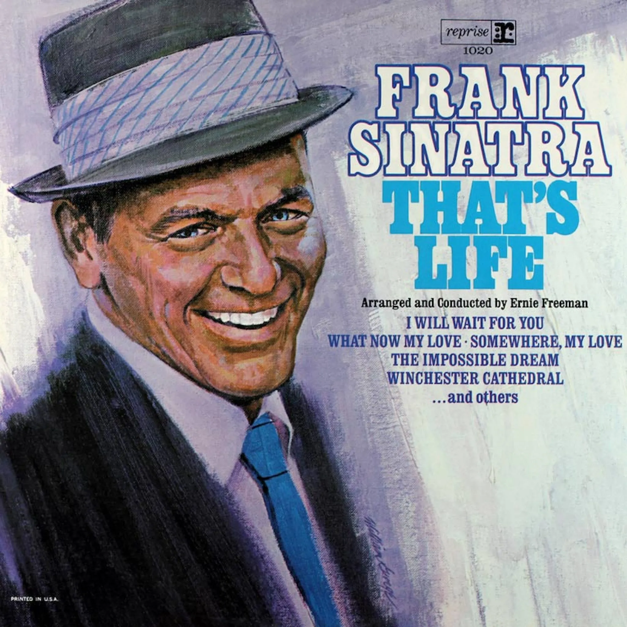 Frank Sinatra in a studio session, smiling while holding a microphone during the recording of his iconic album
