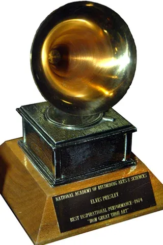 Elvis Presley accepting his third Grammy Award for Best Inspirational Performance for his gospel recording of "How Great Thou Art"