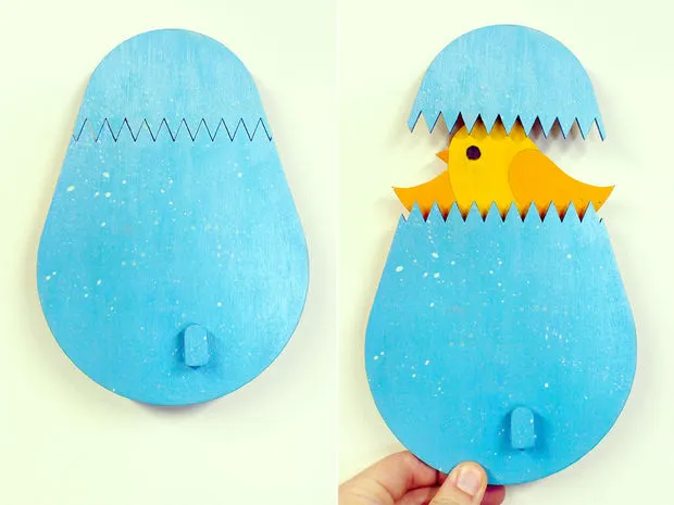 A unique coat hook designed in the shape of a hatching egg