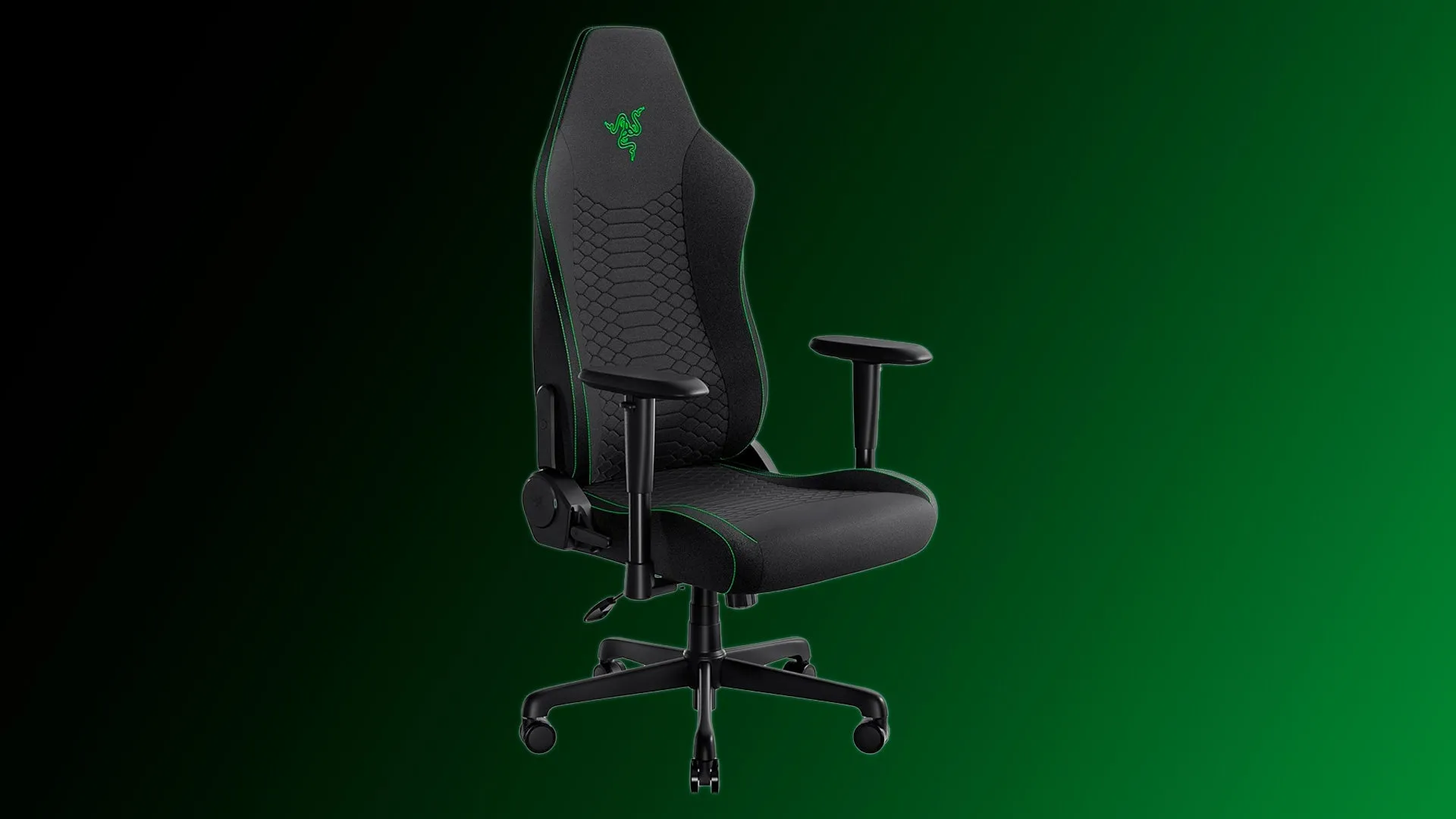 Razer Iskur V2 X gaming chair in a modern gaming setup, showcasing its sleek black fabric and contoured design