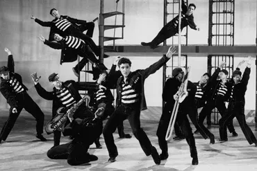 Elvis Presley in a famous still from the movie Jailhouse Rock, performing the iconic title number