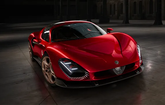 Alfa Romeo 33 Stradale exterior front view showcasing the iconic V-shaped shield and sleek headlights