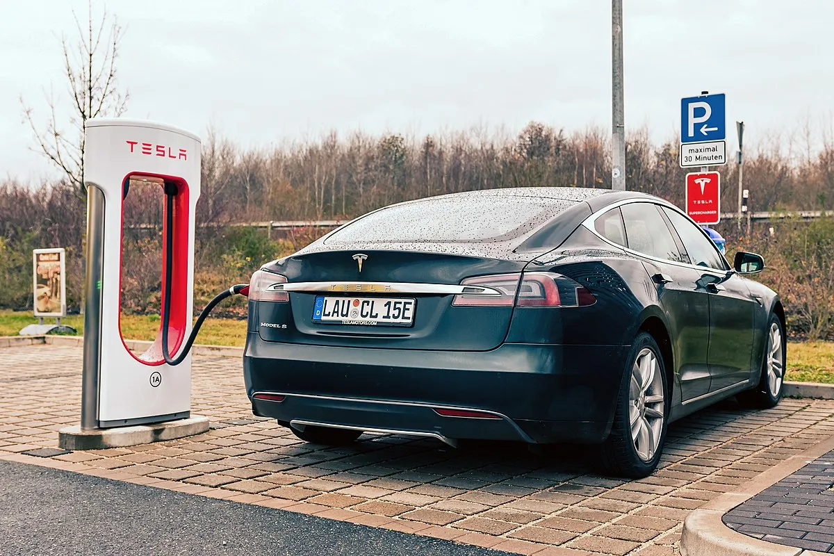 Tesla Model S charging at a Supercharger station in Germany, demonstrating the wide availability of Tesla's fast-charging network