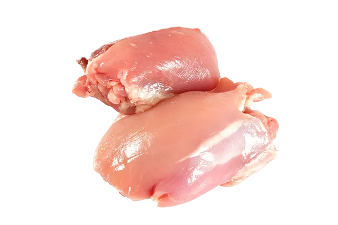 Whole raw chicken thighs used as the primary protein source in JustFoodForDogs fresh dog food