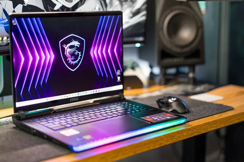 MSI Raider GE68 HX 14VIG gaming laptop featuring a futuristic design, illuminated keyboard, and a prominent cooling system
