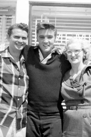 Elvis Presley, Scotty Moore, and Bill Black performing at Sun Studio in the 1950s