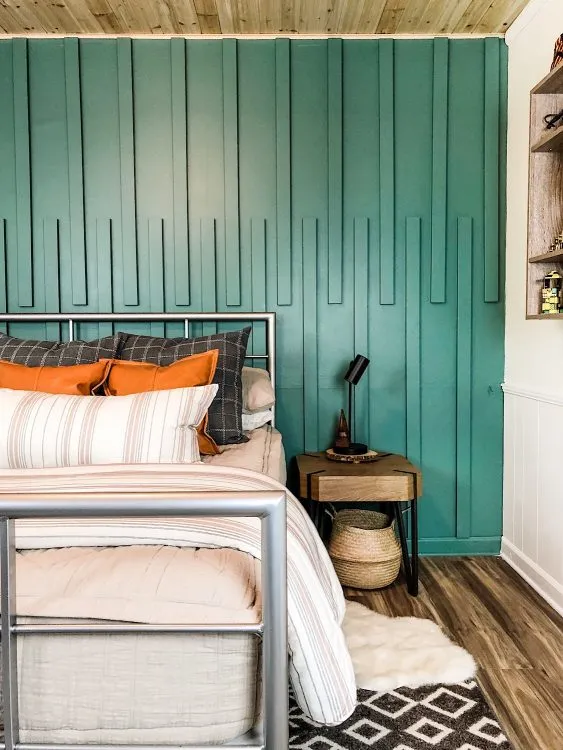 Teen bedroom with green wood accent wall