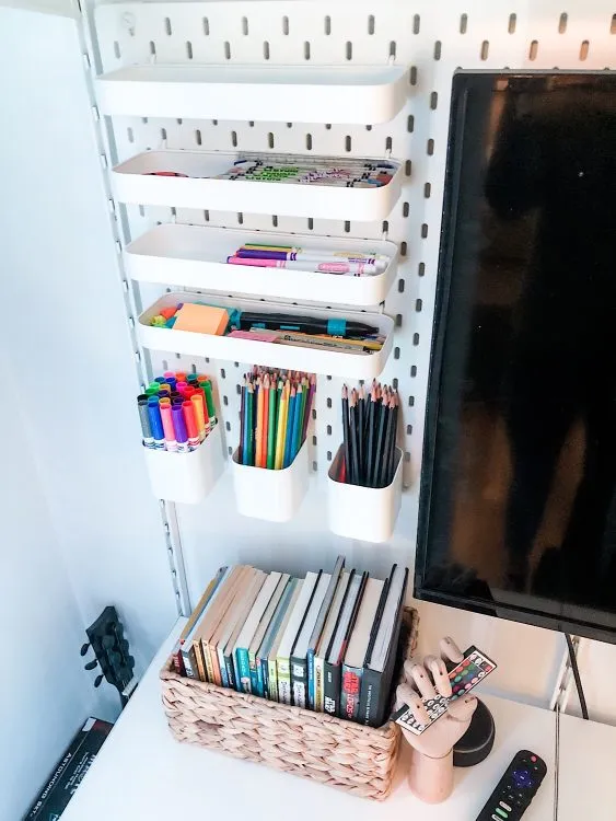 Teen gaming nook inside closet with Ikea pegboard
