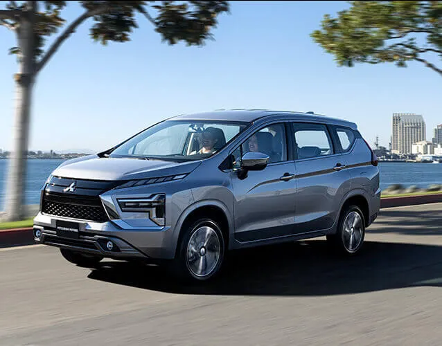 The front three-quarter view of a Mitsubishi Xpander, highlighting its bold and dynamic design.