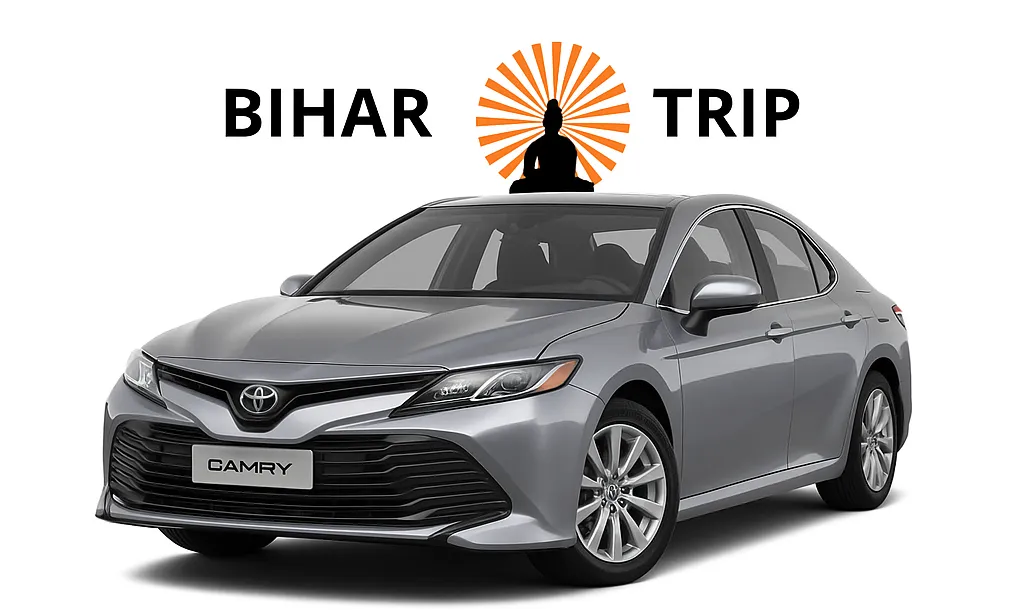 The front grille and headlights of a Toyota Camry luxury sedan, highlighting its refined and modern aesthetic