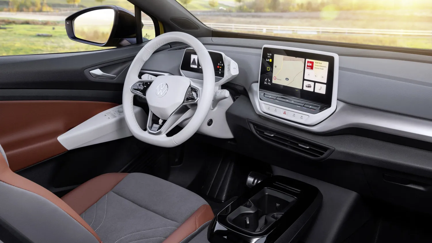Volkswagen ID.4 interior showcasing the large central touchscreen, minimalist dashboard layout, and digital driver display