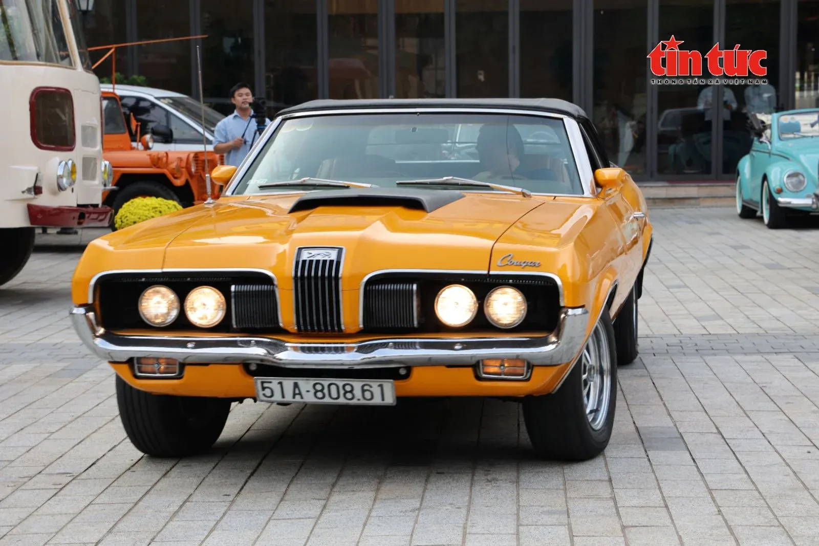 1970 Mercury Cougar Convertible admired by visitors at the classic car event