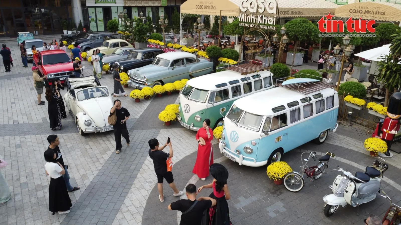 Visitors photographing and admiring the collection of classic cars